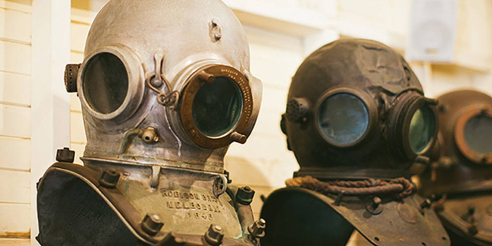 Diver's helmets on display in an Australian museum. The first use of heavy diving equipment was brought to the area by Japanese divers, beginning around 1885, and they are credited with modernizing the pearl fishing industry.